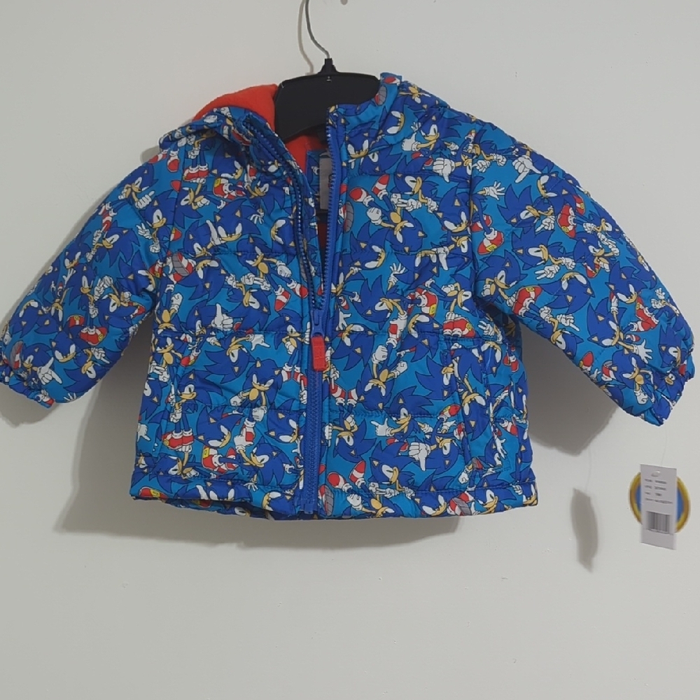 Vibrant Blue Puffer Jacket with Whimsical Print and Hood
